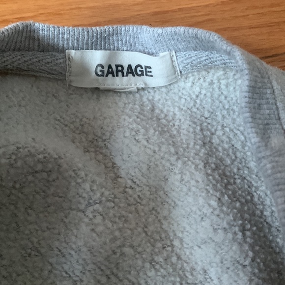 This is a Garage cropped gray sweater. With a white flower stitch design. - Picture 4 of 4